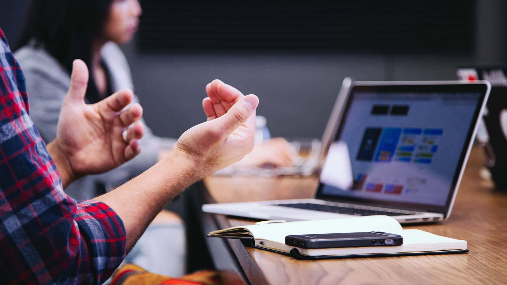 Close up of man's hands and open laptop screen